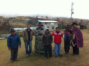 Researchers Miguel La Serna (second from left) and Julián Berrocal Flores (third from right) pose with villagers in front of juez rumi. Researchers Miguel La Serna (second from left) and Julián Berrocal Flores (third from right) pose with villagers in front of juez rumi.
